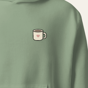 Heart mug left-chest print detail on the Sage Nothing Urgent hoodie