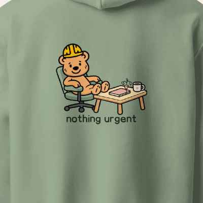 Tee Bear seated at a desk with plant and nothing urgent lettering, back print detail