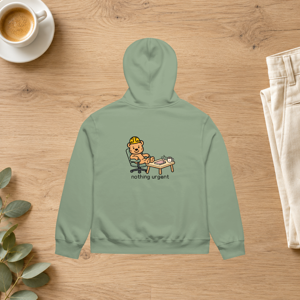 Sage Nothing Urgent hoodie back styled with ivory trousers and coffee in a lifestyle flatlay mockup; props not included