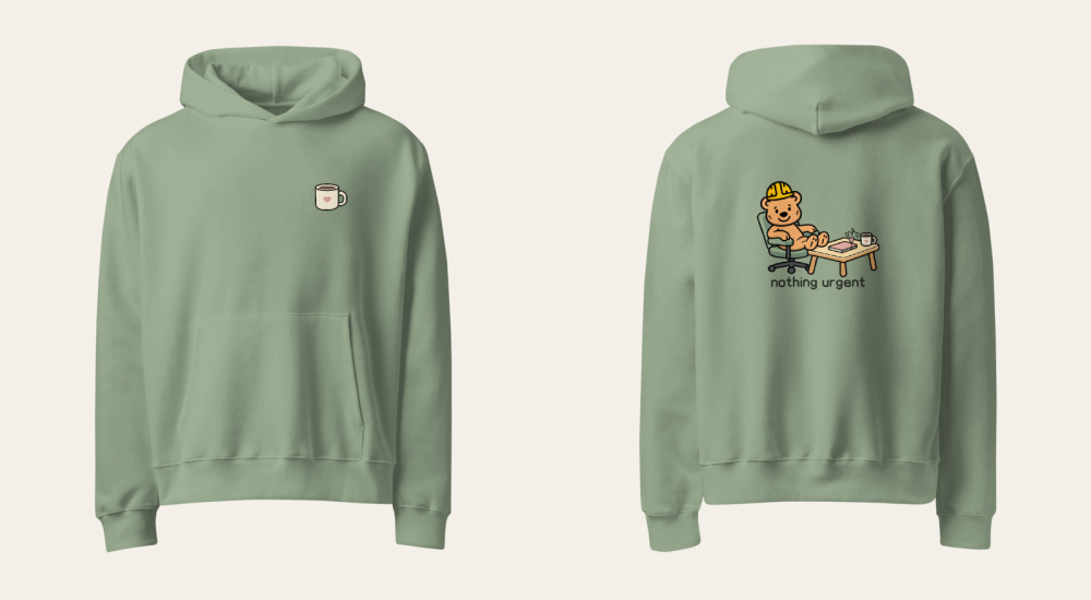 Front and back overview of the Sage Nothing Urgent hoodie showing heart mug chest print and Tee Bear desk scene