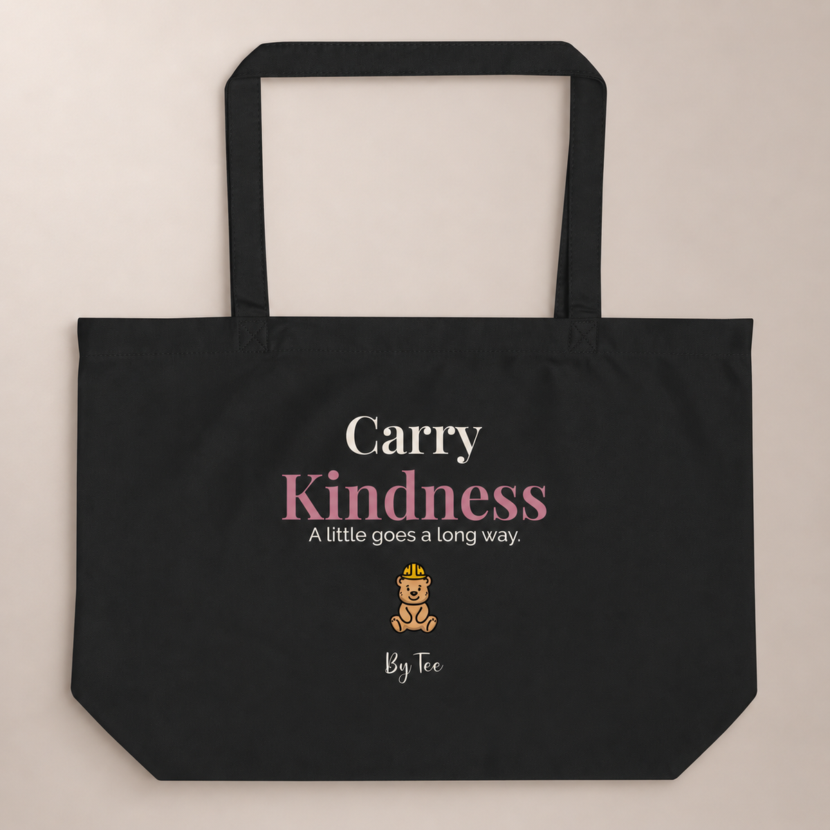 Carry Kindness Tote — Black by By Tee, front view on warm neutral background