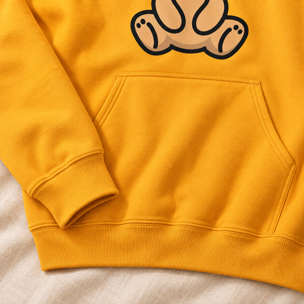Golden Bear Hug Hoodie — pocket cuff detail mockup.