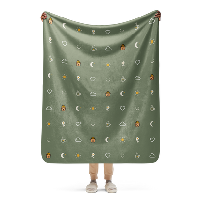 Small Moments Sherpa Throw Blanket — Muted Sage — held open to show the artwork
