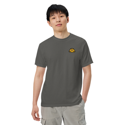 Model wearing the Pepper Work Hard Icons relaxed-fit T-shirt with the original yellow helmet on the wearer-left chest.