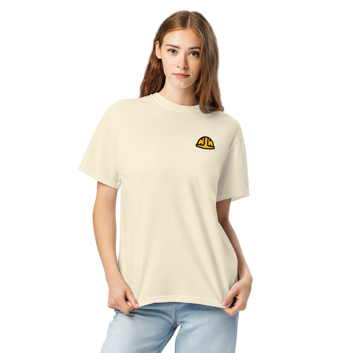 Model wearing the Ivory Work Hard Icons relaxed-fit T-shirt with the original yellow helmet on the wearer-left chest.
