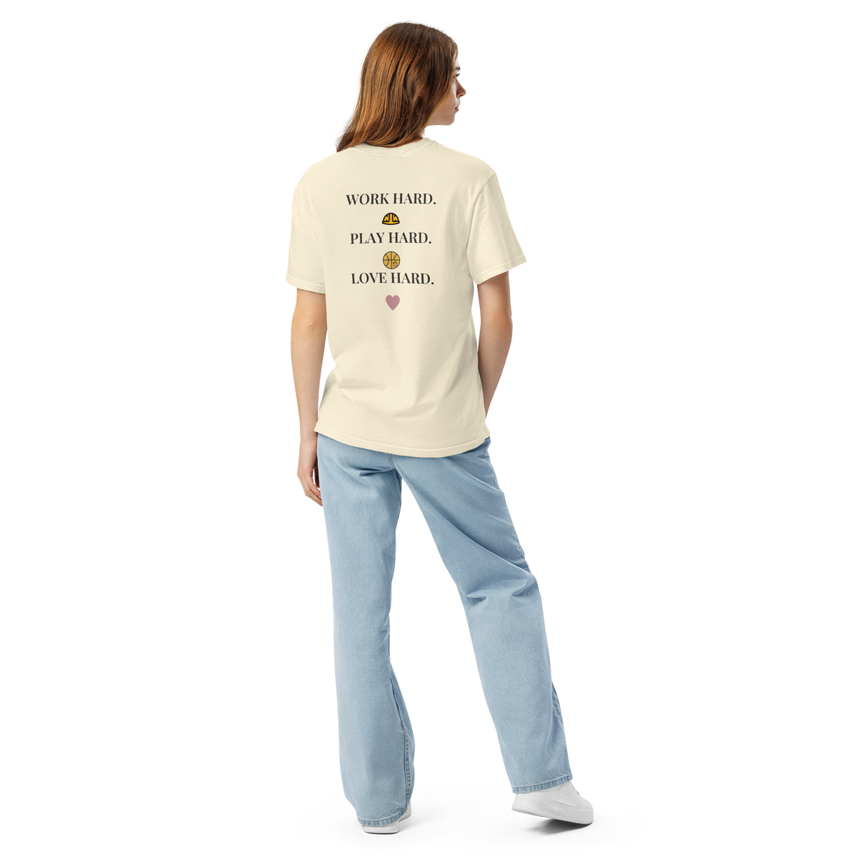 Full-length model wearing the Ivory Work Hard Icons relaxed-fit T-shirt, showing the back slogan and helmet, basketball with a bear-head emblem, and heart.